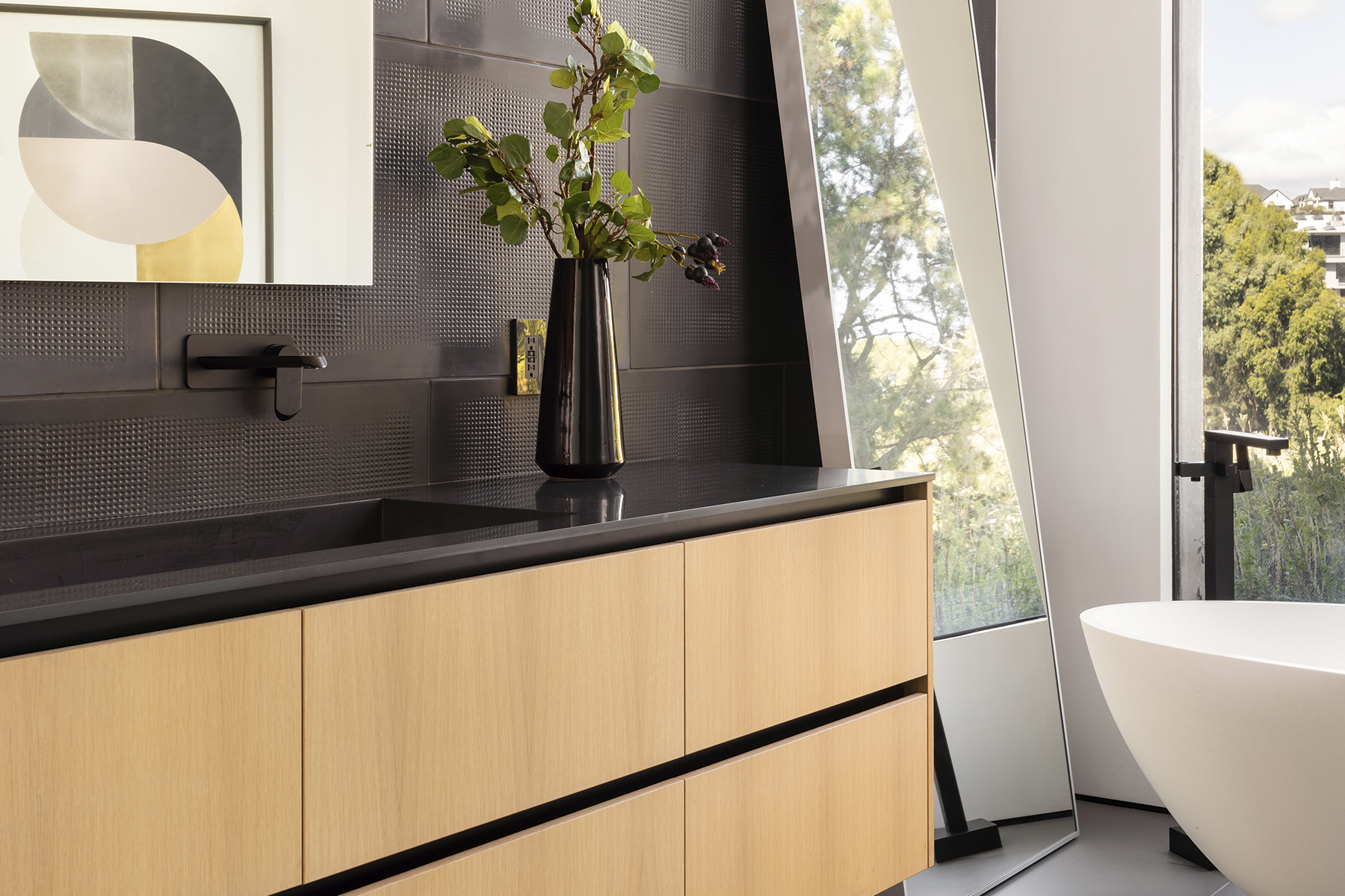 A beautiful bathroom, with a floating bathtub and a sink.